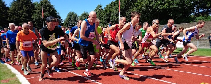 A group of people starting a race on a race track