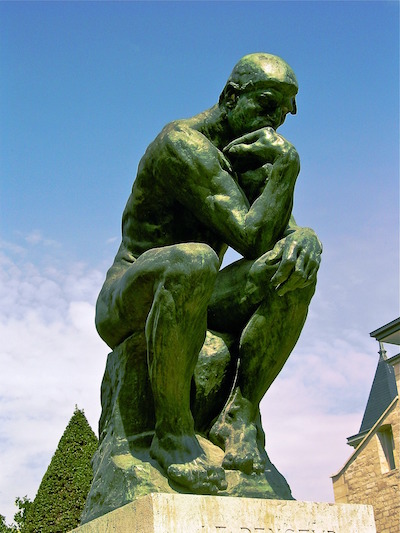 A picture of the bronze statue by Auguste Rodin, “Le Penseur” or “The Thinker.”